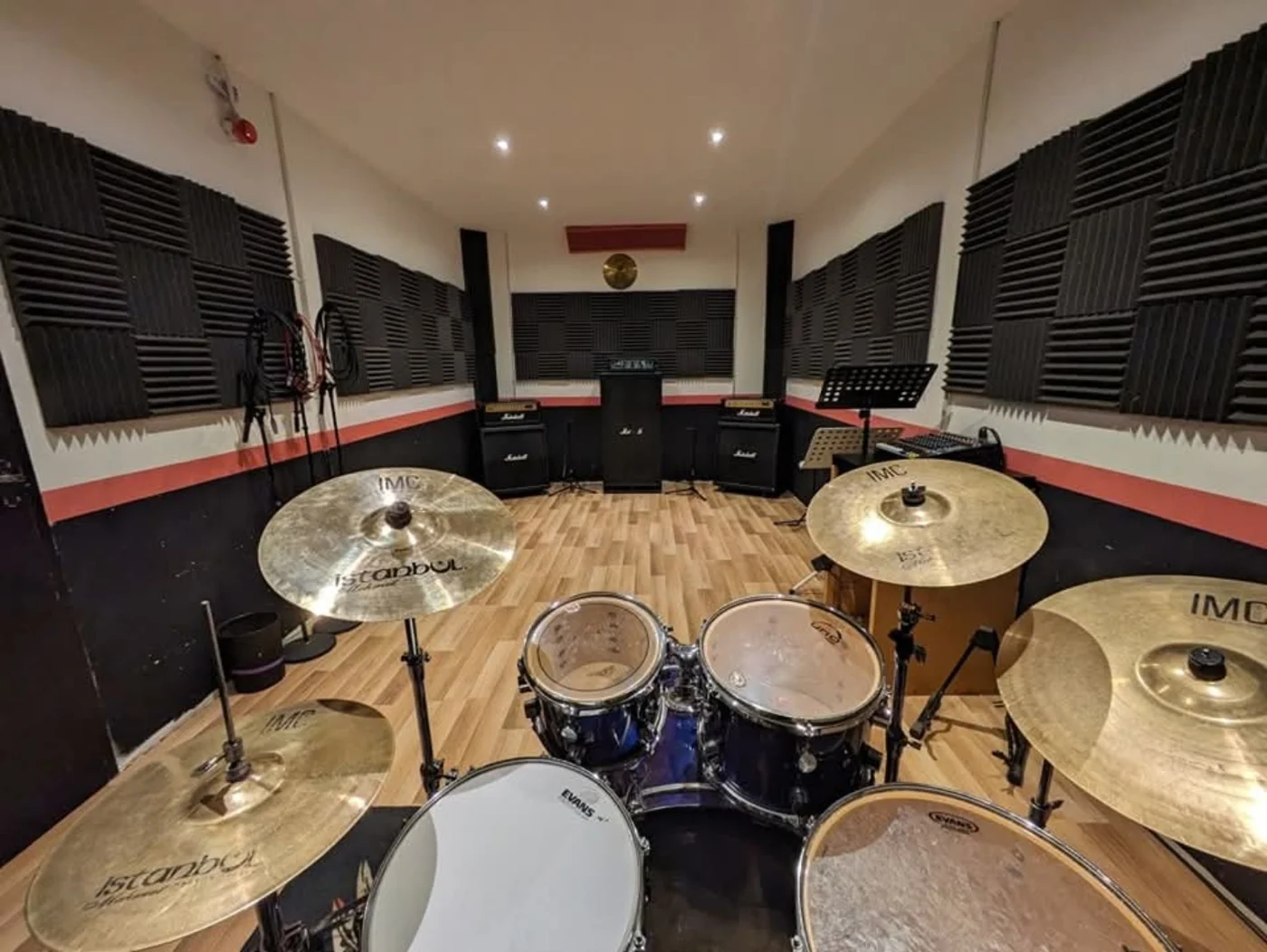 Rehearsal room viewed from behind the drum kit