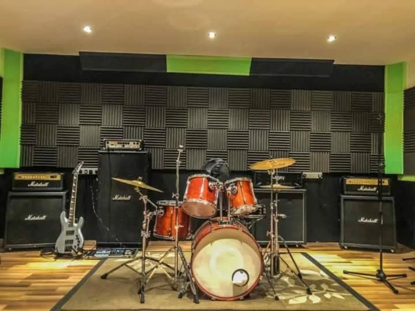 Drum kit, amplifiers and acoustic treatment in an Overall Studios rehearsal room